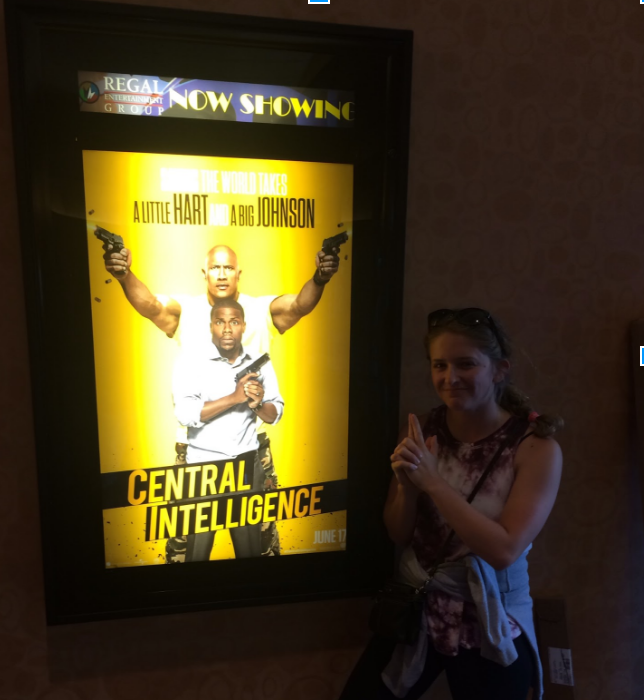 Madison posing by the poster for "Central Intelligence". Madison Heller | Clarion