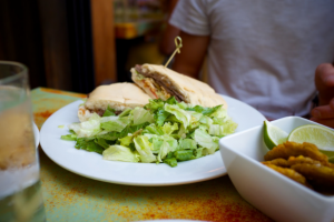 The Pan con Bistec sandwich with disappointing side salad. Justin Cygan | Clarion 